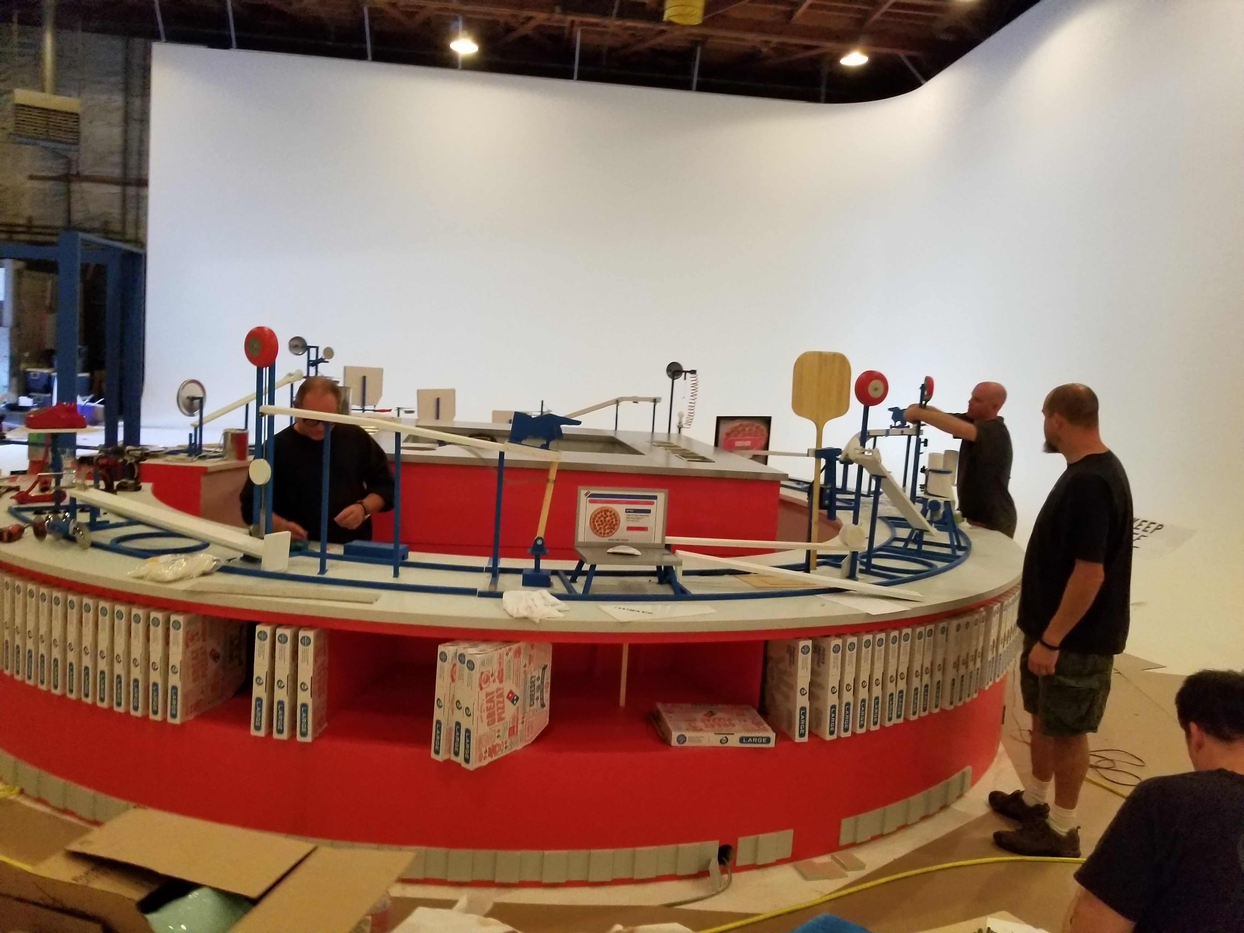 Dominoes Rube Goldberg Machine ad Photos